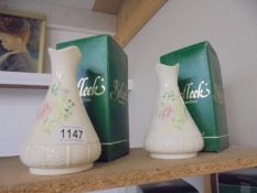 A boxed pair of Belleek vases.