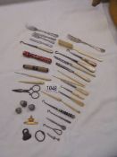 A mixed lot of sewing and manicure tools.
