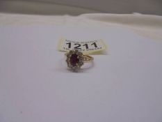 9ct yellow gold ring set with oval ruby and a halo of RBC diamonds. Ruby 1.00ct approx. Diamonds