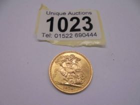 A Elizabeth II 1974 gold sovereign.