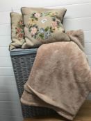 Grey Linen basket with 2 tapestry cushion and a brown throw