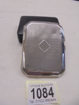 A silver cigarette case, Birmingham 1924/25, slight dints.