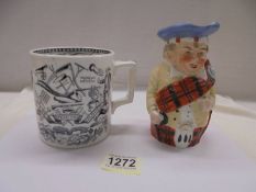 An old "God Speed the Plough" tankard and a Scotsman Toby jug.