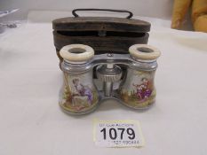 A fine cased pair of hand painted opera glassses marked W Watson & Sons, Opticians, 30 High Holborn,