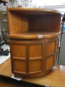 A 'Nathan' teak bow front corner unit COLLECT ONLY.