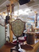 A Victorian mahogany pole screen with shield shaped screen, COLLECT ONLY