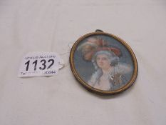 A miniature oval portrait of a lady, 8 x 6.75 cm.