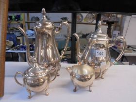 A four piece silver plate tea set.