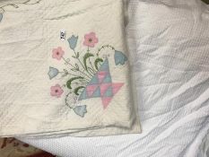 Single duvet with cover on and single bed Spread with embroidery plaque flower design.