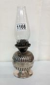 A Victorian Hinks silver plated bedroom oil lamp.