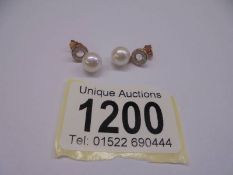 Pair of 9ct rose gold suspended cultured pearl & diamond halo droplet earrings. R/C diamonds 0.15ct