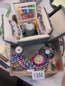 A sewing kit and other sewing items.