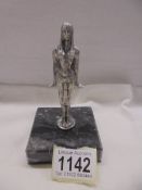 A white metal Art Deco style figure of an Egyptian, 12.5 cm tall.
