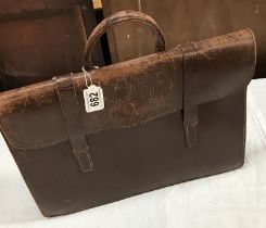 Leather bag with unique metal bar to close
