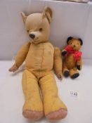 An old Teddy bear and a vintage Sooty bear, both in need of TLC.