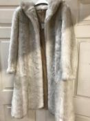 Size 16 Faux Fur Ladies coat. General wear and marks. Metal hook and eye fastening