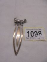 A silver bookmark with cat finial.