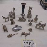 A mixed lot of white metal animals and a miniature vase.