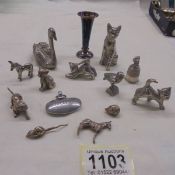 A mixed lot of white metal animals and a miniature vase.