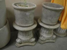 A pair of garden urns on short plinths, 70 cm high, COLLECT ONLY.