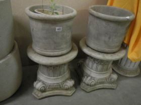 A pair of garden urns on short plinths, 70 cm high, COLLECT ONLY.