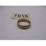 A 9ct gold wedding band size N, 3 grams.