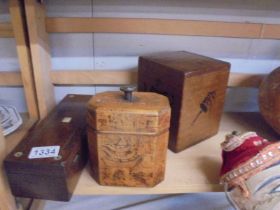 A vintage tea caddy and two other boxes.