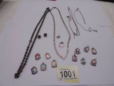A mixed lot of silver items including necklaces, chains, charms etc.,