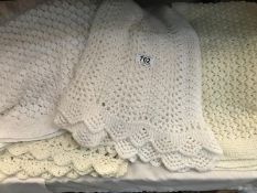 A quantity of knitted blankets and 1 small baby pram cover