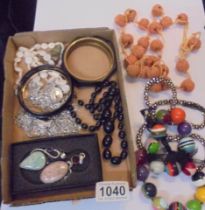 A quantity of stylist necklaces, pendants, mother of pearl bracelets etc.,