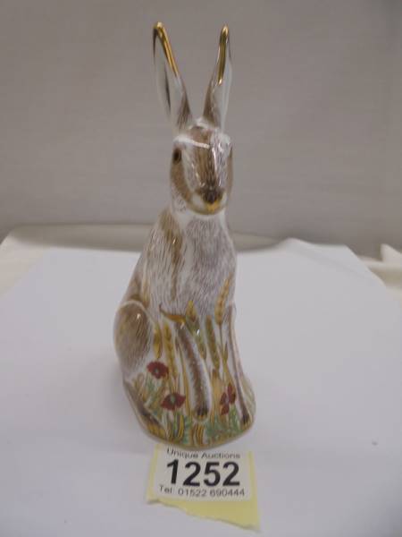 A Royal Crown Derby Midsummer Hare with gold stopper.