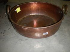 A large copper firewood bucket.
