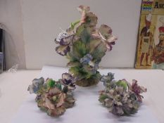 Three floral ornaments including candleholders. a/f.