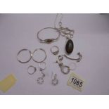 A mixed lot of silver jewellery including an amber pendant, amber set bracelet, rings, earrings etc