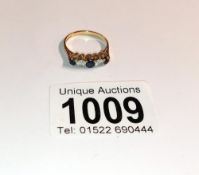 A 9ct gold five stone ring, size N half, 2.2 grams.