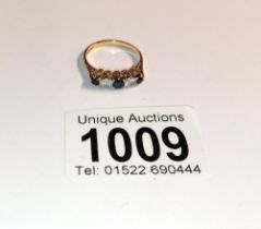 A 9ct gold five stone ring, size N half, 2.2 grams.