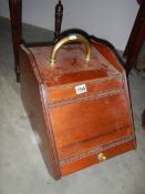 An Edwardian mahogany slope front coal box complete with liner and shovel, COLLECT ONLY.