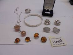 A mixed lot of silver jewellery including some set with amber.