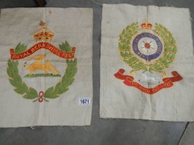 Two embroidered military crests.