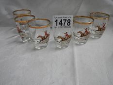 A set of six mid 20th century toddy glasses featuring horses with riders.
