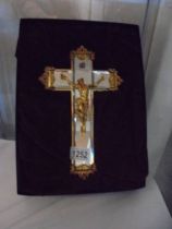 A boxed glass and gilded crucifix.