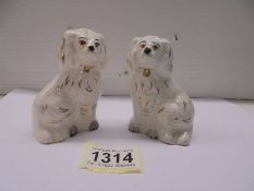 A miniature pair of Beswick Staffordshire style spaniels.
