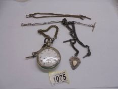 An Elgin USA pocket watch with various pocket watch chains.