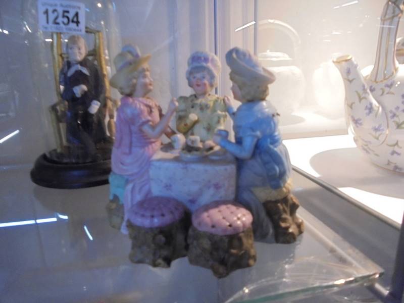 A nodding head figure, a nodding head three figure tea party group and a figure under a dome. - Image 4 of 4