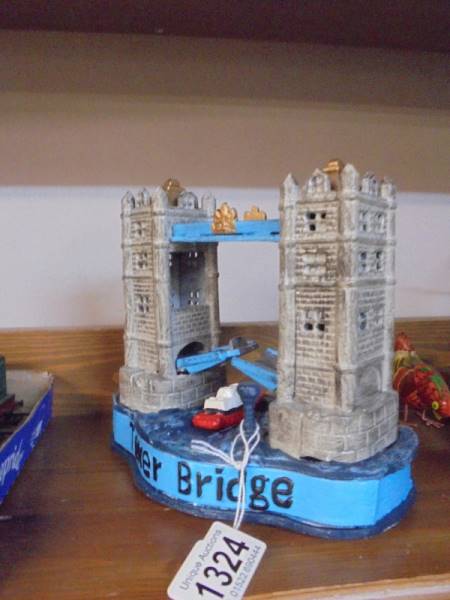 A novelty cast iron Tower bridge money bank.