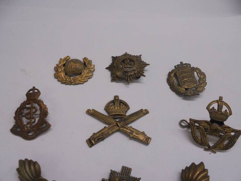 A quantity of military cap badges including Royal Army Medical Corps. - Image 2 of 3