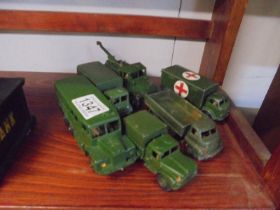 Six Dinky military vehicles.
