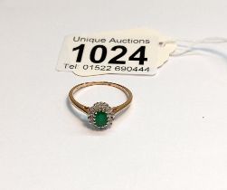 An 18ct yellow gold diamond and emerald ring, size S, 2.2 grams.