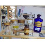 A mixed lot of chemist bottles.