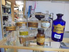 A mixed lot of chemist bottles.